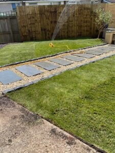 Turf laid in customer garden British Soil